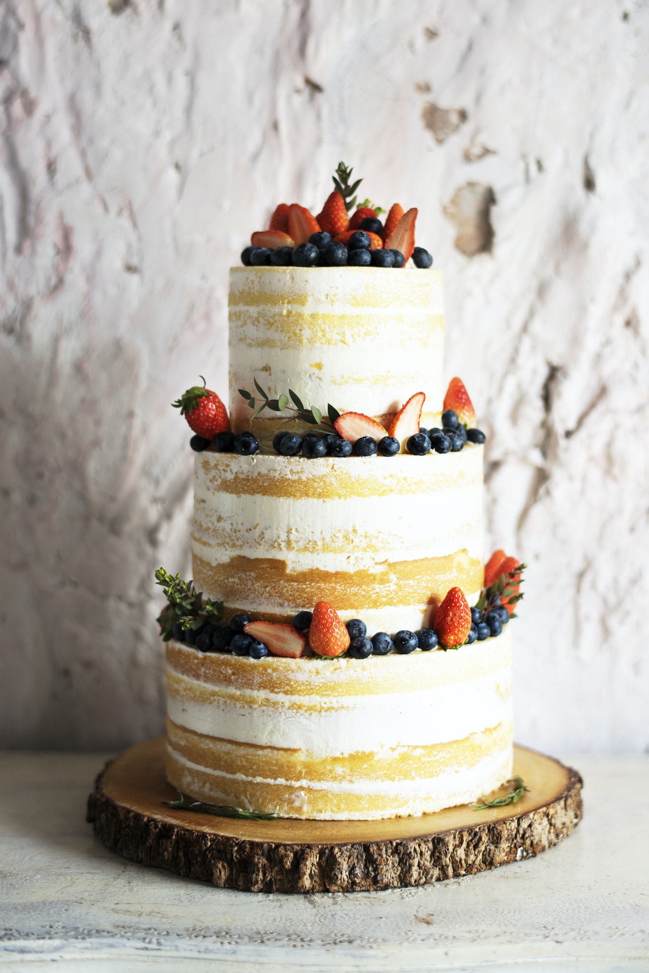 White Wedding Cake with Berries Decoration